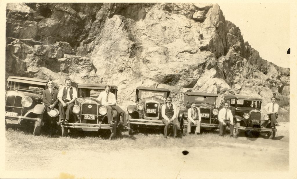 Successful Lowell business men gathered in the countryside to admire their automobiles before the Great Depression took hold.